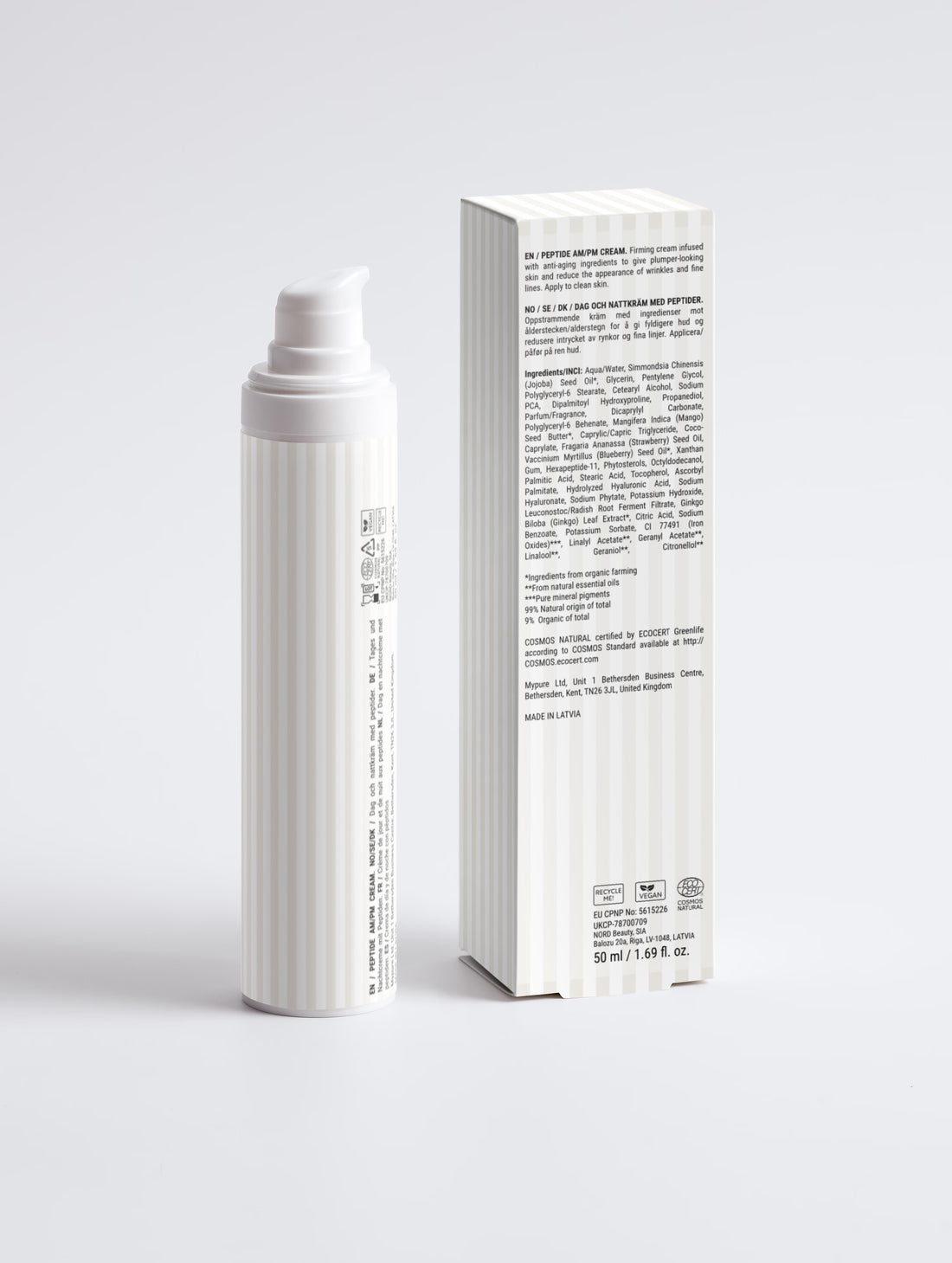 The cream bottle beside the carton, ingredient panel facing out